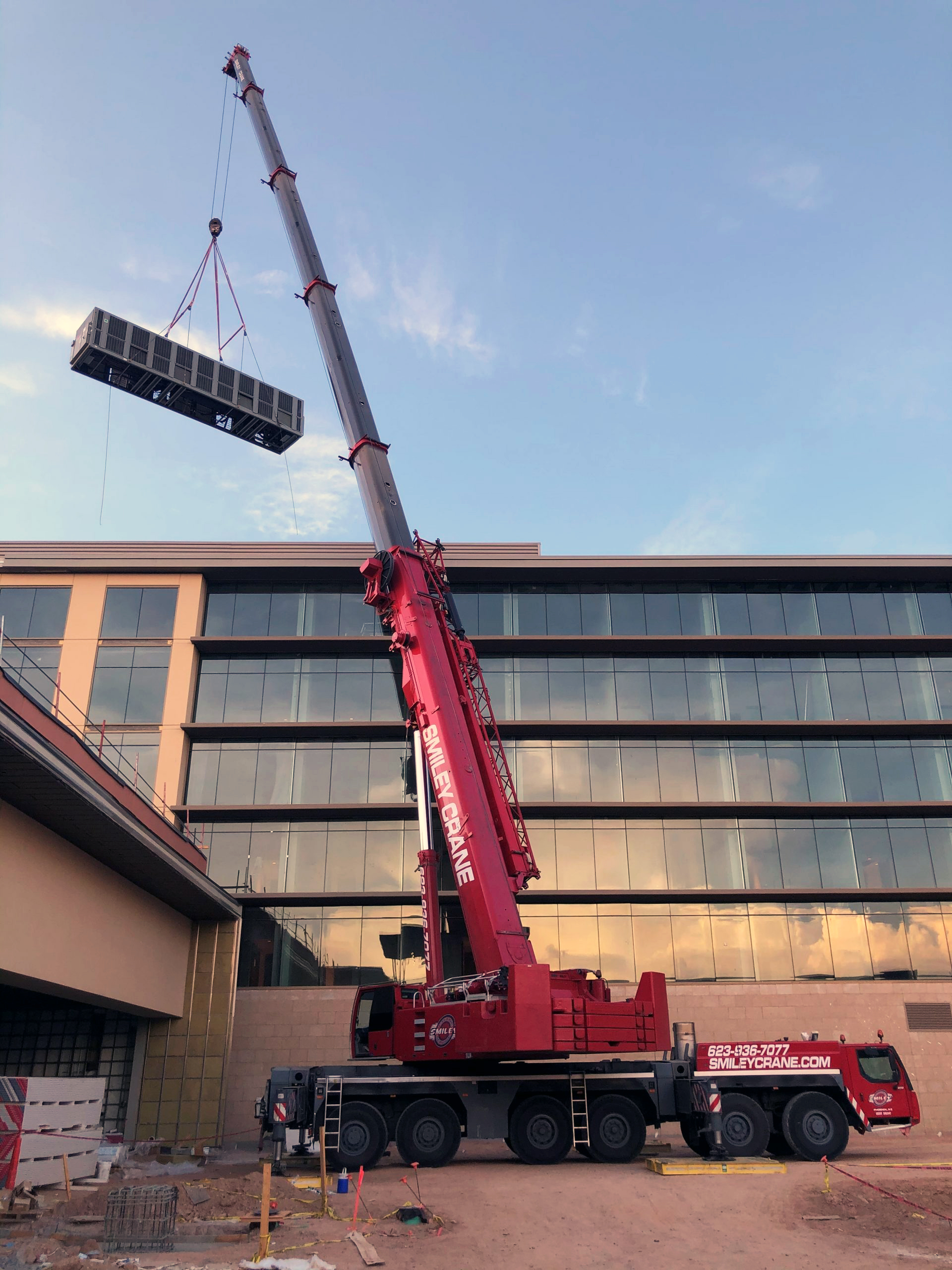 Smiley Crane Lifting a Customers Chiller